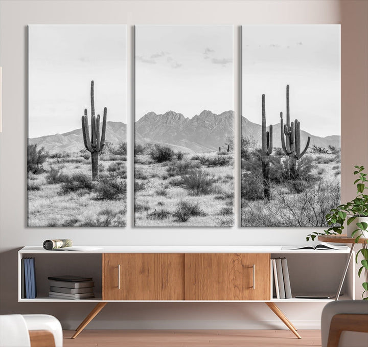 The modern living room showcases the "Black White Arizona Desert Canvas Wall Art Cactus Farmhouse Wall Art," a triptych consisting of gallery-wrapped, museum-quality black-and-white desert landscape photographs featuring cacti.