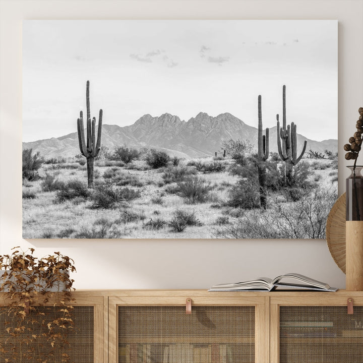 The modern living room showcases the "Black White Arizona Desert Canvas Wall Art Cactus Farmhouse Wall Art," a triptych consisting of gallery-wrapped, museum-quality black-and-white desert landscape photographs featuring cacti.