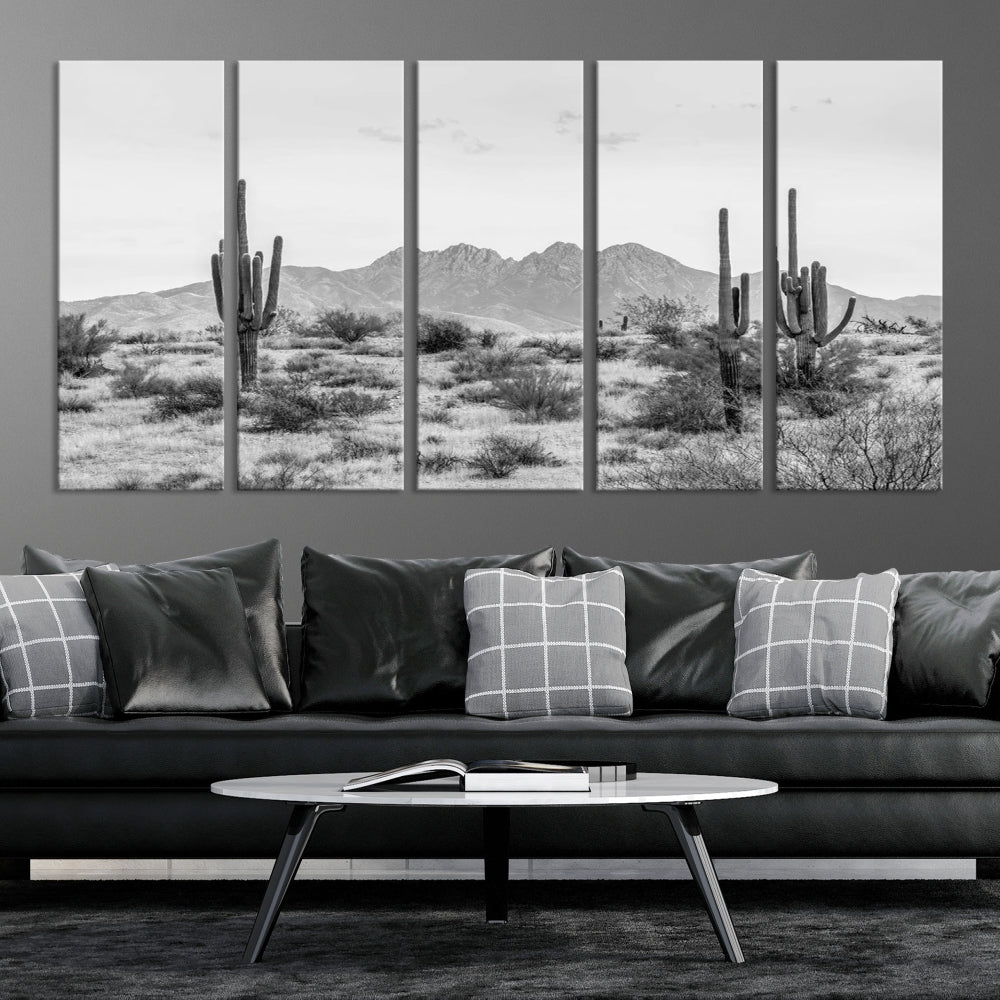 The modern living room showcases the "Black White Arizona Desert Canvas Wall Art Cactus Farmhouse Wall Art," a triptych consisting of gallery-wrapped, museum-quality black-and-white desert landscape photographs featuring cacti.