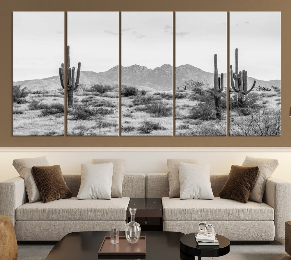 The modern living room showcases the "Black White Arizona Desert Canvas Wall Art Cactus Farmhouse Wall Art," a triptych consisting of gallery-wrapped, museum-quality black-and-white desert landscape photographs featuring cacti.