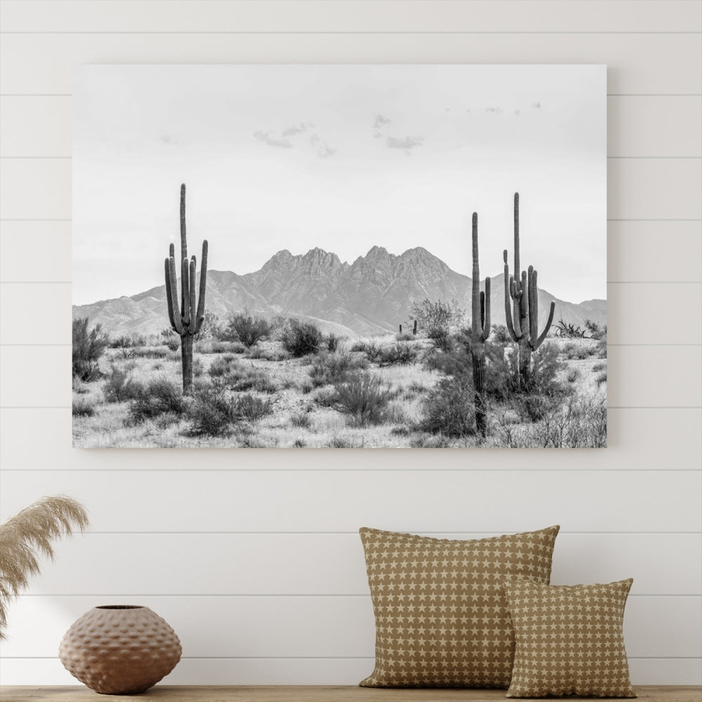 The modern living room showcases the "Black White Arizona Desert Canvas Wall Art Cactus Farmhouse Wall Art," a triptych consisting of gallery-wrapped, museum-quality black-and-white desert landscape photographs featuring cacti.