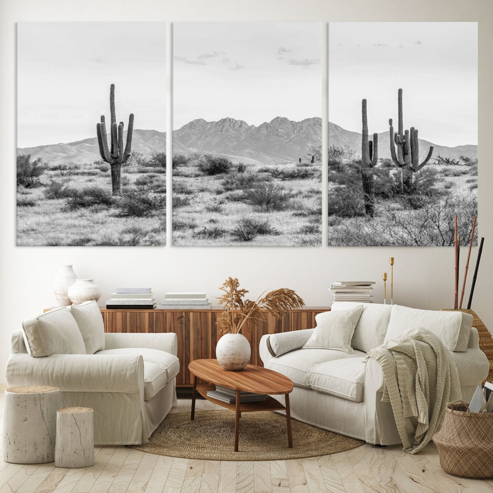 The modern living room showcases the "Black White Arizona Desert Canvas Wall Art Cactus Farmhouse Wall Art," a triptych consisting of gallery-wrapped, museum-quality black-and-white desert landscape photographs featuring cacti.