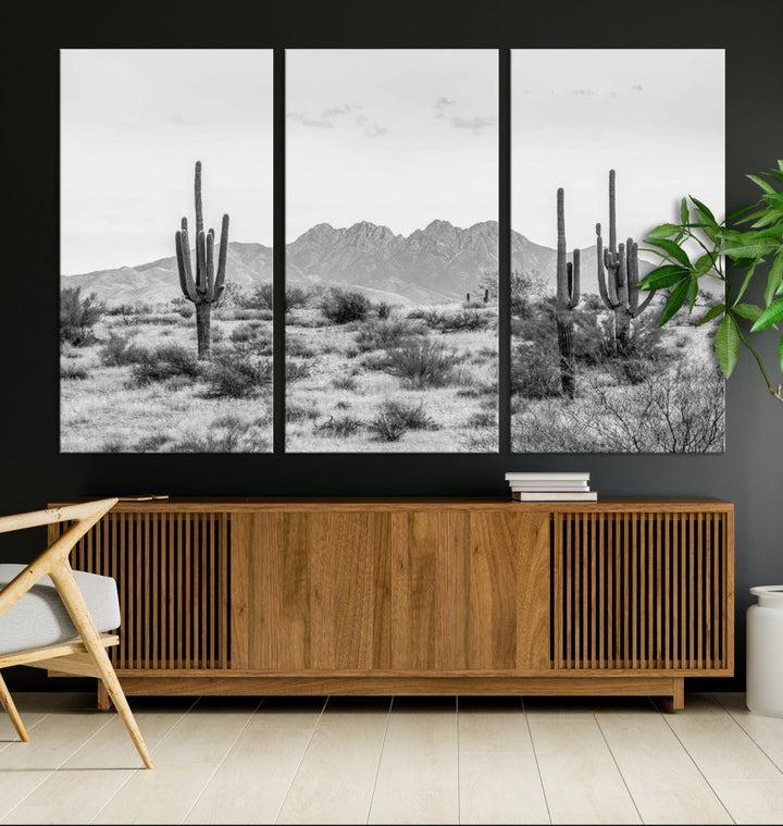 The modern living room showcases the "Black White Arizona Desert Canvas Wall Art Cactus Farmhouse Wall Art," a triptych consisting of gallery-wrapped, museum-quality black-and-white desert landscape photographs featuring cacti.