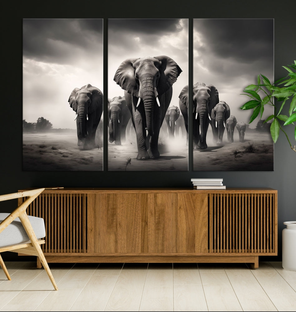 The Black White Elephant Family Wall Art Canvas Print is a stunning triptych artwork featuring elephants marching, displayed on a museum-quality canvas. Enjoy its UV-protective coating that ensures lasting beauty.