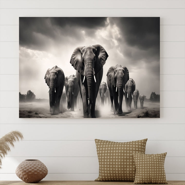 The Black White Elephant Family Wall Art Canvas Print is a stunning triptych artwork featuring elephants marching, displayed on a museum-quality canvas. Enjoy its UV-protective coating that ensures lasting beauty.