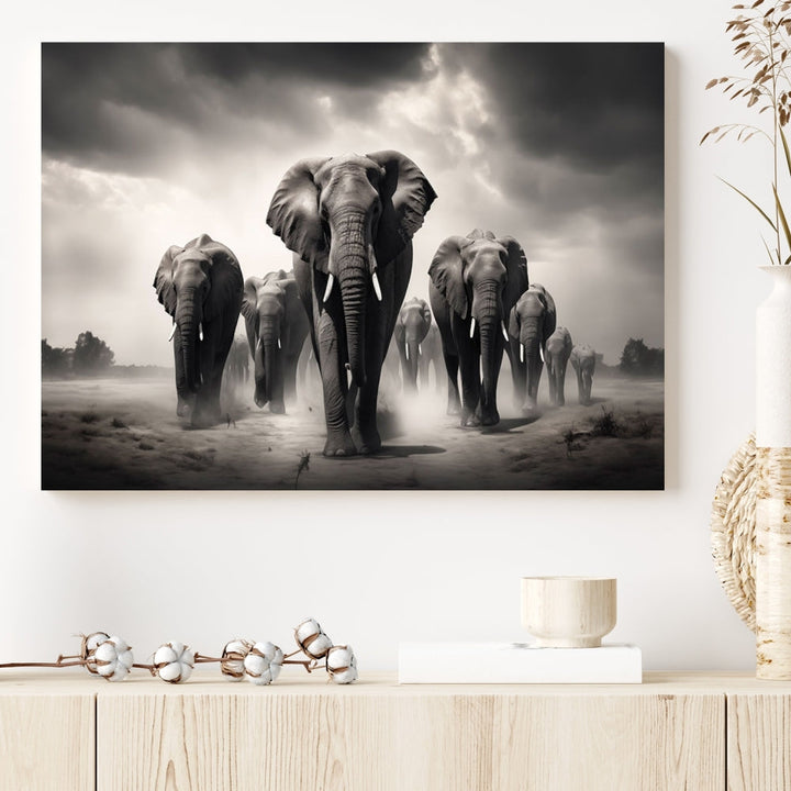 The Black White Elephant Family Wall Art Canvas Print is a stunning triptych artwork featuring elephants marching, displayed on a museum-quality canvas. Enjoy its UV-protective coating that ensures lasting beauty.