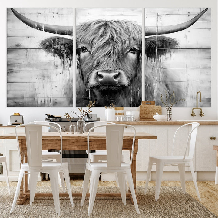 The Black White Highland Cow Wall Art Canvas Print, crafted on museum-quality canvases with a UV-protective coating, adds an elegant touch to the rustic wooden backdrop.