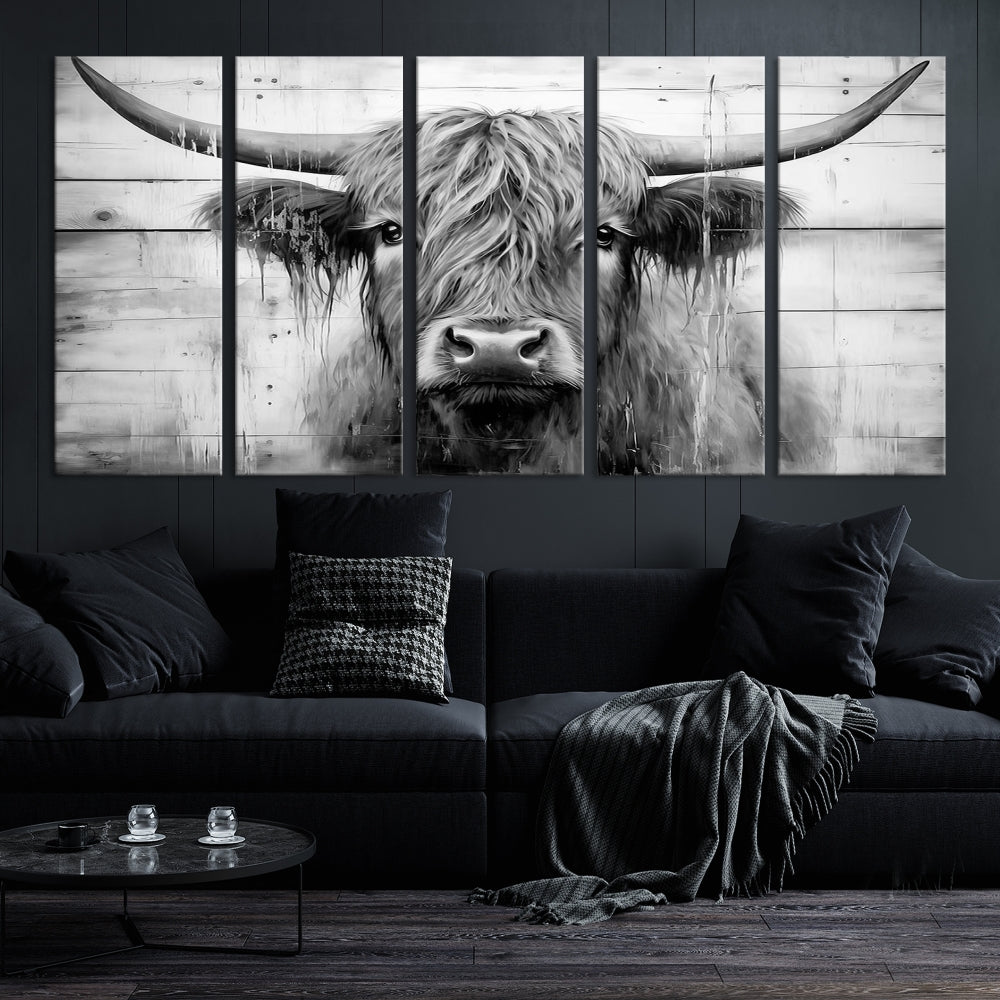 The Black White Highland Cow Wall Art Canvas Print, crafted on museum-quality canvases with a UV-protective coating, adds an elegant touch to the rustic wooden backdrop.