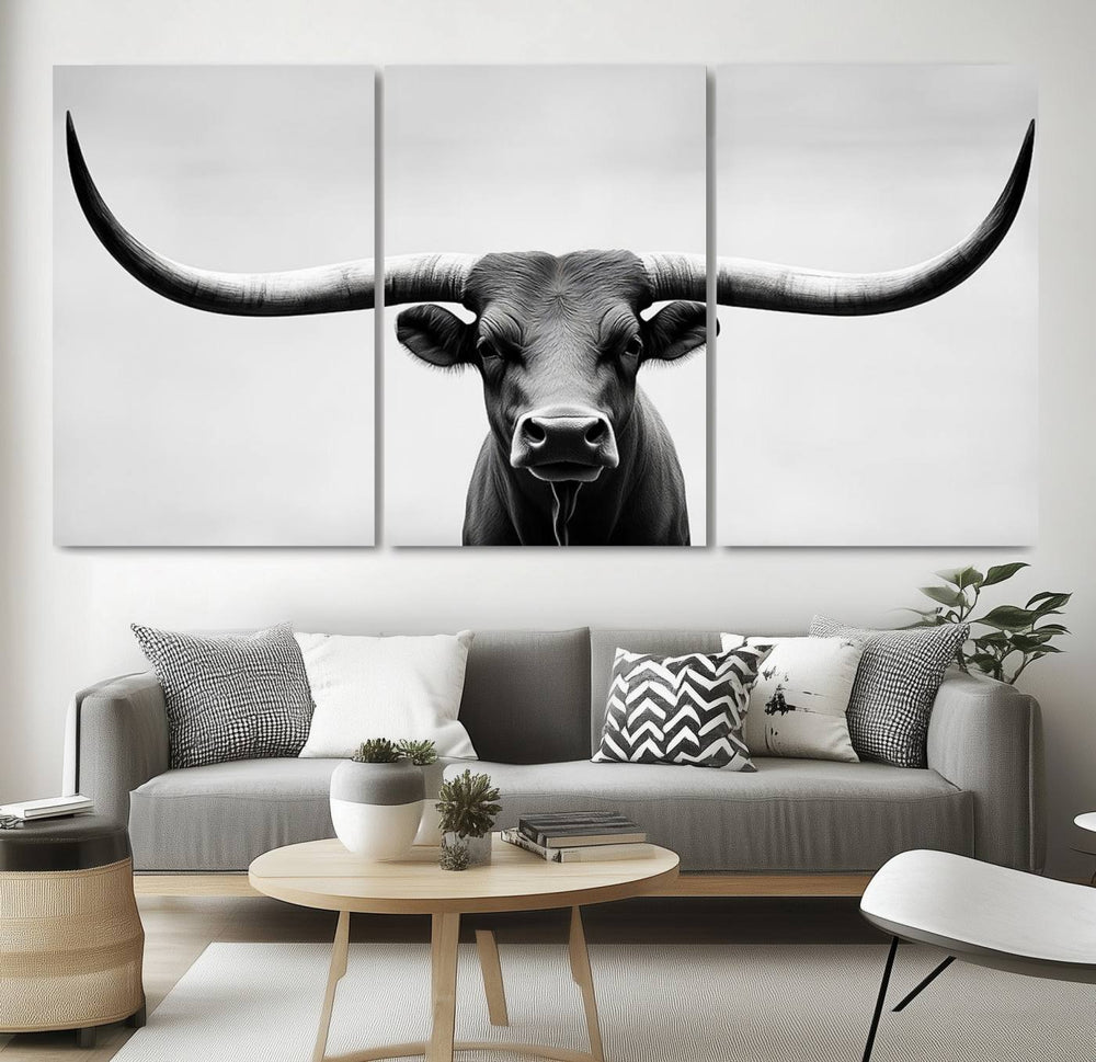 A striking Black White Texas Longhorn Bull Horns Wall Art Canvas Print adorns the wall, creating a stylish living room that seamlessly blends contemporary flair with rustic farmhouse charm.