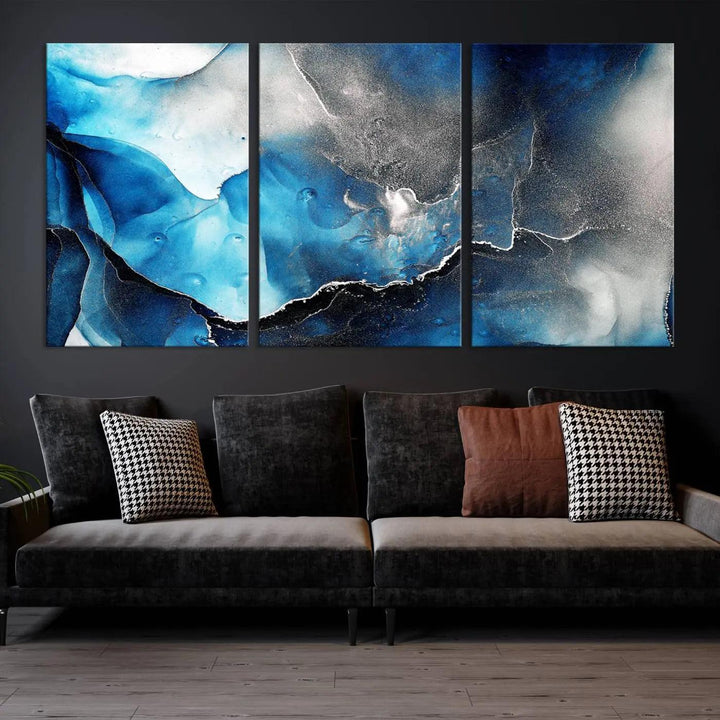 The Blue and Black Marble Fluid Effect Wall Art Abstract Canvas Prints feature three dynamic swirling patterns in blue, black, and white. Crafted on museum-quality canvases and enhanced with a UV-protective coating, these prints maintain their vibrant allure over time.