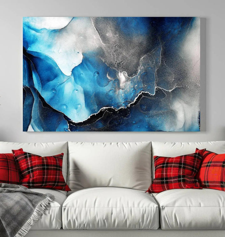 The Blue and Black Marble Fluid Effect Wall Art Abstract Canvas Prints feature three dynamic swirling patterns in blue, black, and white. Crafted on museum-quality canvases and enhanced with a UV-protective coating, these prints maintain their vibrant allure over time.