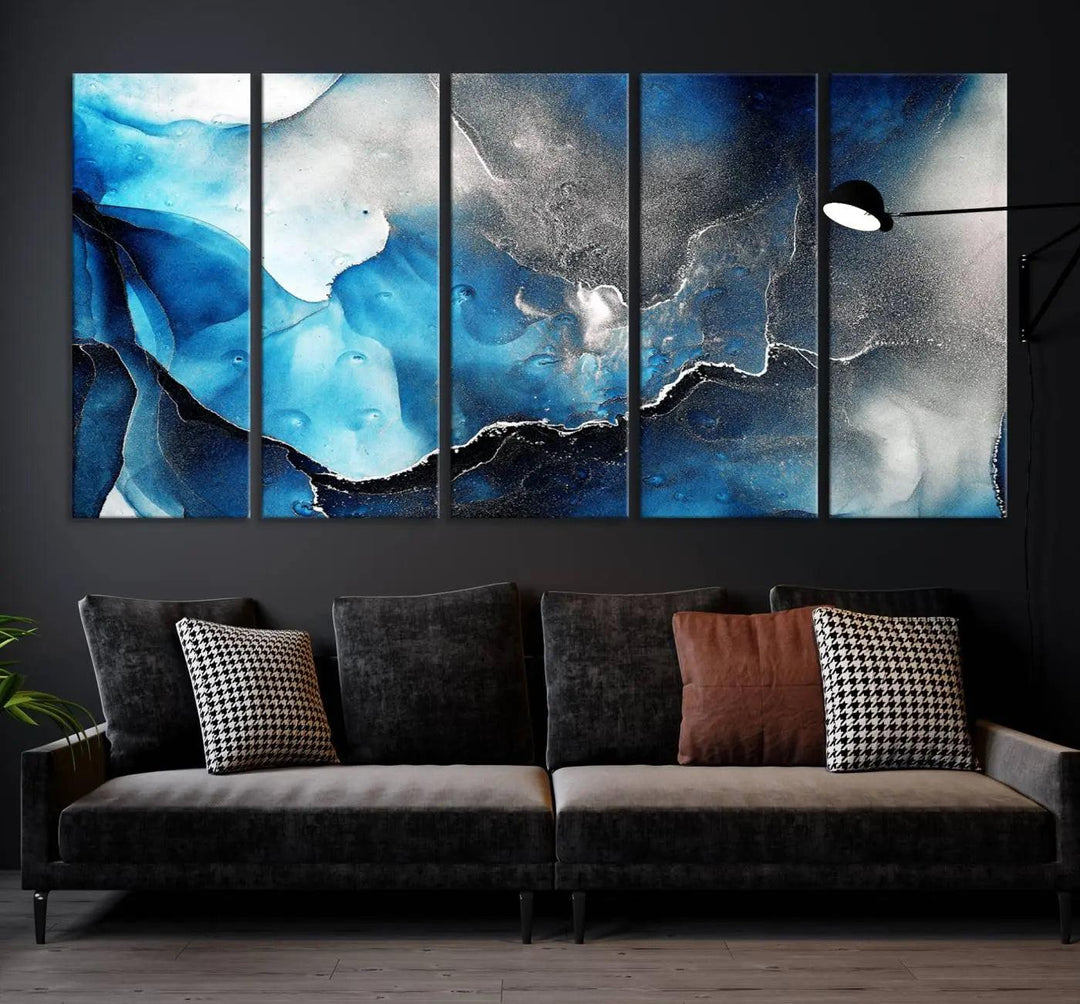 The Blue and Black Marble Fluid Effect Wall Art Abstract Canvas Prints feature three dynamic swirling patterns in blue, black, and white. Crafted on museum-quality canvases and enhanced with a UV-protective coating, these prints maintain their vibrant allure over time.