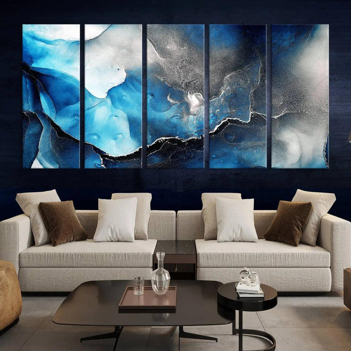 The Blue and Black Marble Fluid Effect Wall Art Abstract Canvas Prints feature three dynamic swirling patterns in blue, black, and white. Crafted on museum-quality canvases and enhanced with a UV-protective coating, these prints maintain their vibrant allure over time.