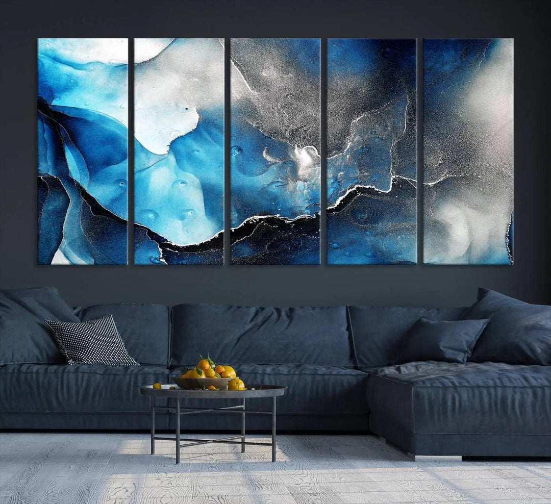 The Blue and Black Marble Fluid Effect Wall Art Abstract Canvas Prints feature three dynamic swirling patterns in blue, black, and white. Crafted on museum-quality canvases and enhanced with a UV-protective coating, these prints maintain their vibrant allure over time.