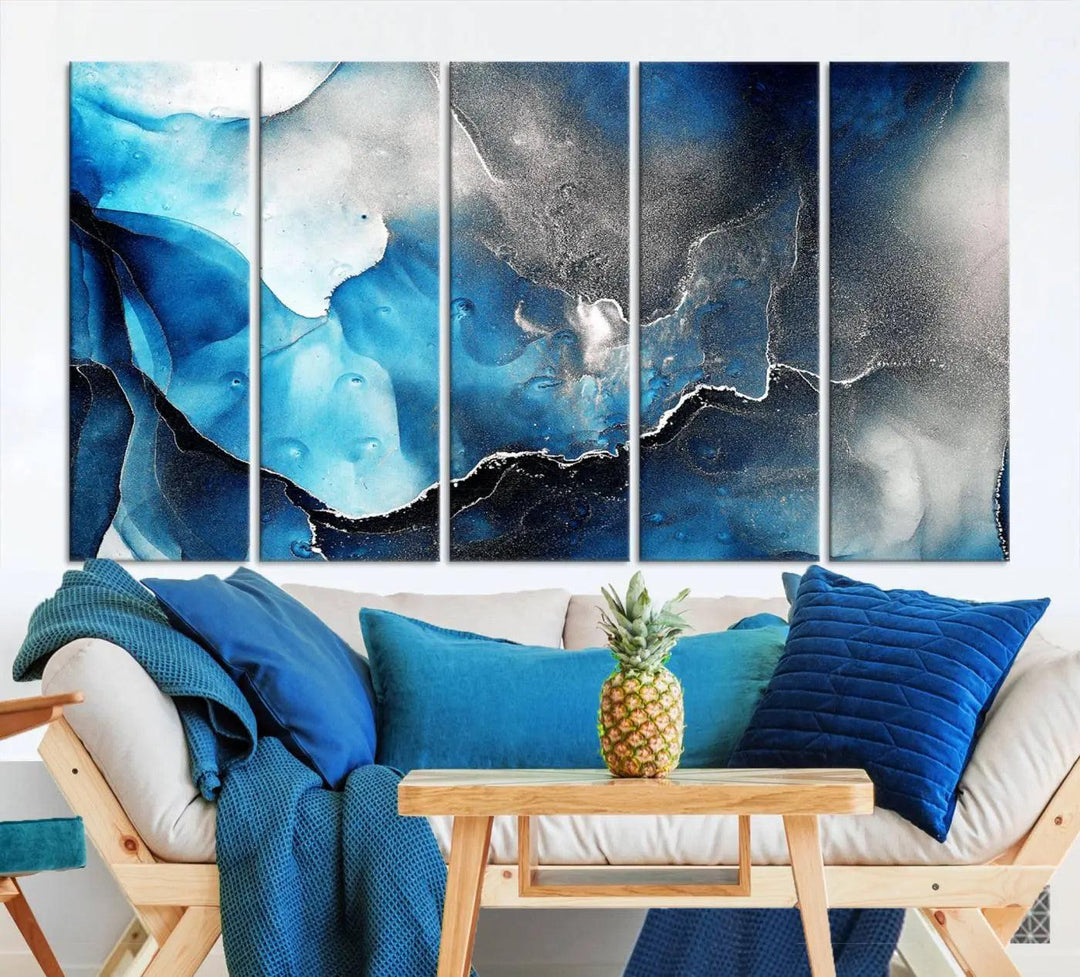 The Blue and Black Marble Fluid Effect Wall Art Abstract Canvas Prints feature three dynamic swirling patterns in blue, black, and white. Crafted on museum-quality canvases and enhanced with a UV-protective coating, these prints maintain their vibrant allure over time.