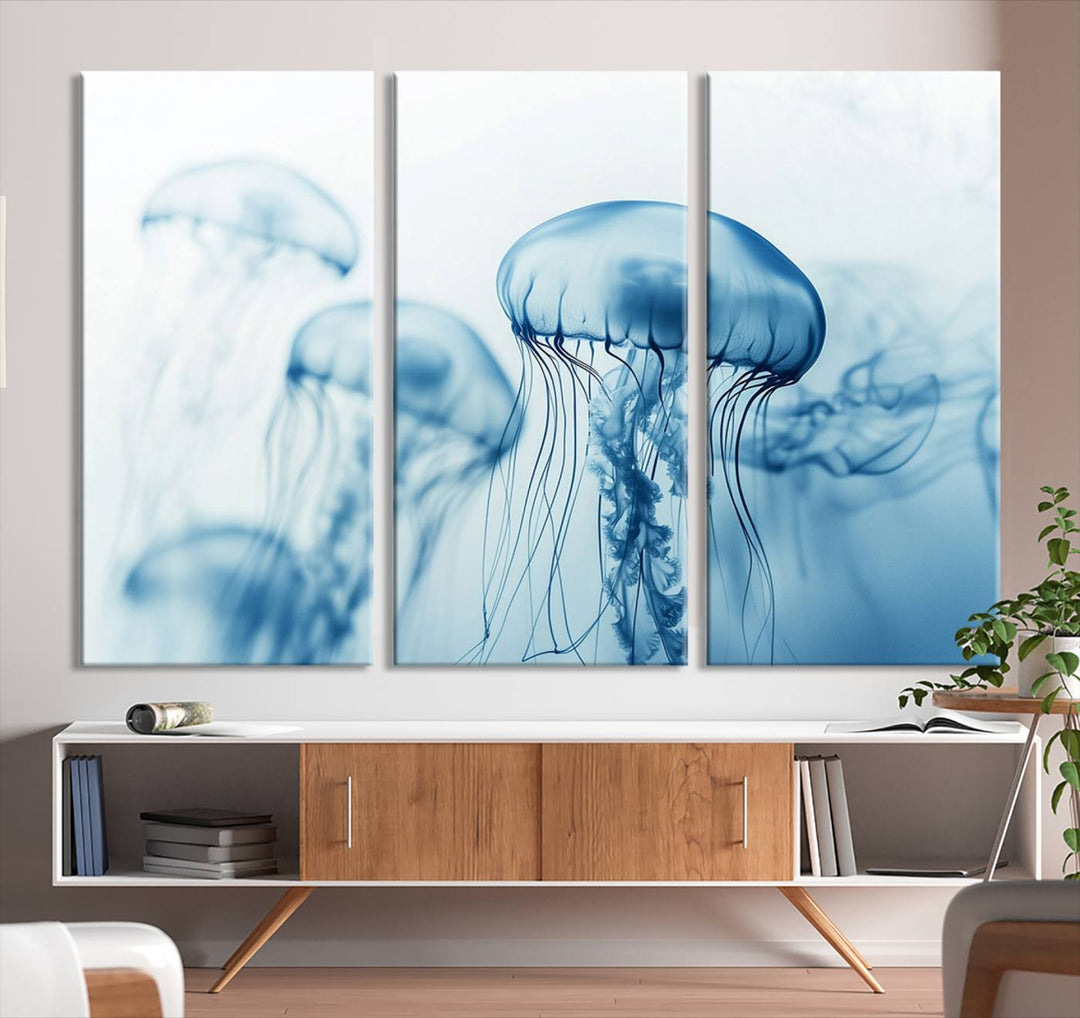 A breathtaking triptych of the Blue Jellyfish Wall Art Canvas Print decorates the space, beautifully highlighted by an overhead lamp. Each canvas is created on museum-quality material using high-resolution printing and includes a UV-protective coating to ensure long-lasting vibrancy.