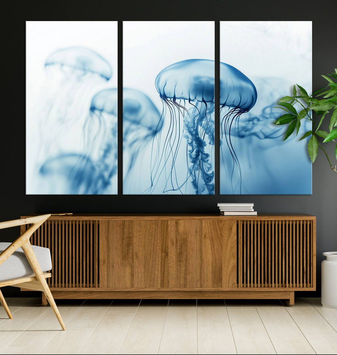 A breathtaking triptych of the Blue Jellyfish Wall Art Canvas Print decorates the space, beautifully highlighted by an overhead lamp. Each canvas is created on museum-quality material using high-resolution printing and includes a UV-protective coating to ensure long-lasting vibrancy.