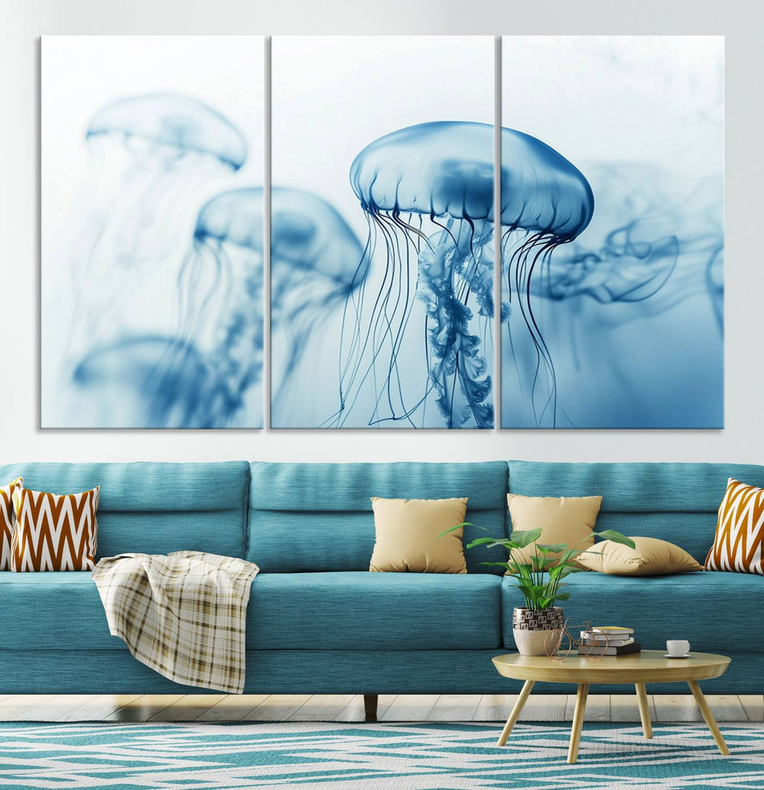 A breathtaking triptych of the Blue Jellyfish Wall Art Canvas Print decorates the space, beautifully highlighted by an overhead lamp. Each canvas is created on museum-quality material using high-resolution printing and includes a UV-protective coating to ensure long-lasting vibrancy.