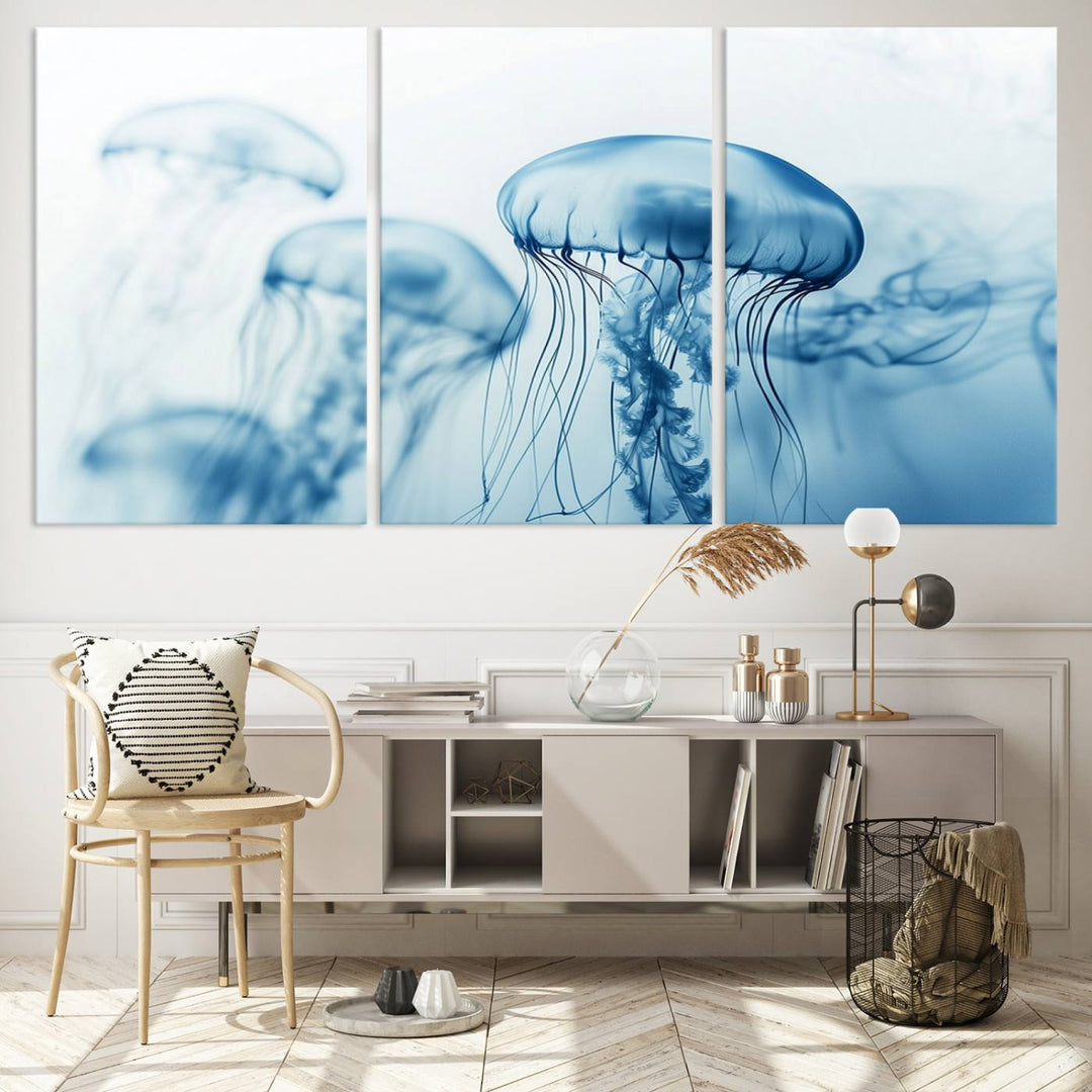 A breathtaking triptych of the Blue Jellyfish Wall Art Canvas Print decorates the space, beautifully highlighted by an overhead lamp. Each canvas is created on museum-quality material using high-resolution printing and includes a UV-protective coating to ensure long-lasting vibrancy.