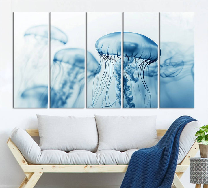 A breathtaking triptych of the Blue Jellyfish Wall Art Canvas Print decorates the space, beautifully highlighted by an overhead lamp. Each canvas is created on museum-quality material using high-resolution printing and includes a UV-protective coating to ensure long-lasting vibrancy.