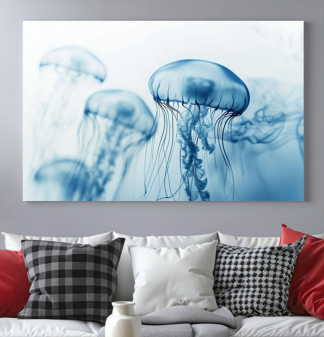 A breathtaking triptych of the Blue Jellyfish Wall Art Canvas Print decorates the space, beautifully highlighted by an overhead lamp. Each canvas is created on museum-quality material using high-resolution printing and includes a UV-protective coating to ensure long-lasting vibrancy.