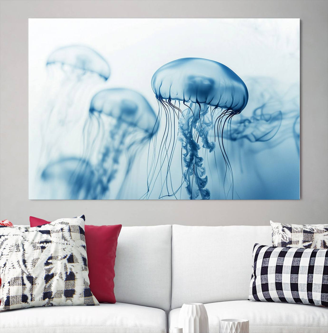 A breathtaking triptych of the Blue Jellyfish Wall Art Canvas Print decorates the space, beautifully highlighted by an overhead lamp. Each canvas is created on museum-quality material using high-resolution printing and includes a UV-protective coating to ensure long-lasting vibrancy.