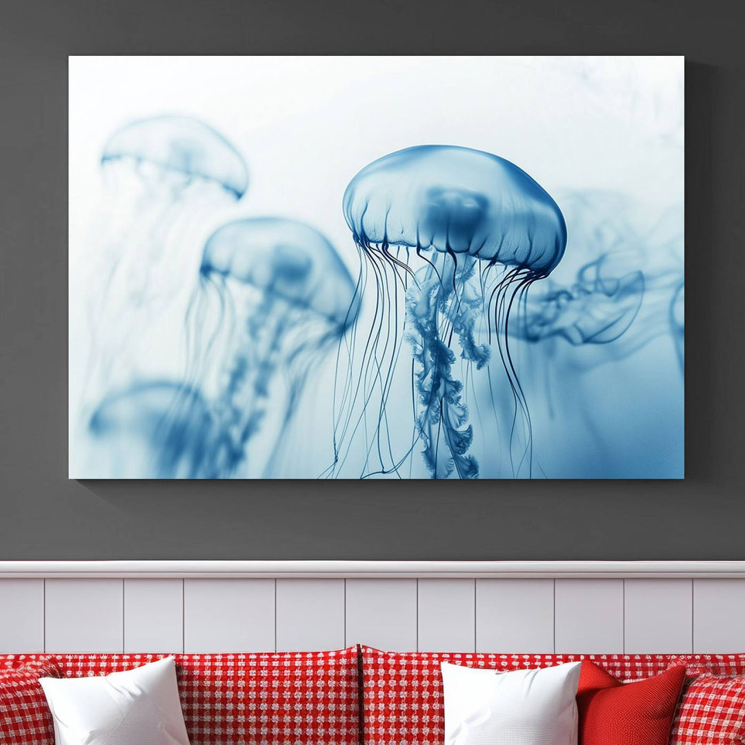 A breathtaking triptych of the Blue Jellyfish Wall Art Canvas Print decorates the space, beautifully highlighted by an overhead lamp. Each canvas is created on museum-quality material using high-resolution printing and includes a UV-protective coating to ensure long-lasting vibrancy.