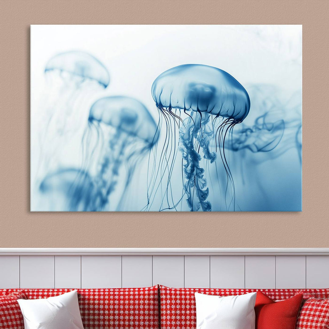 A breathtaking triptych of the Blue Jellyfish Wall Art Canvas Print decorates the space, beautifully highlighted by an overhead lamp. Each canvas is created on museum-quality material using high-resolution printing and includes a UV-protective coating to ensure long-lasting vibrancy.