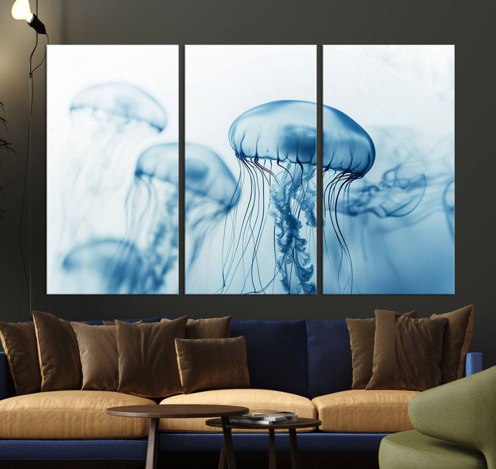 A breathtaking triptych of the Blue Jellyfish Wall Art Canvas Print decorates the space, beautifully highlighted by an overhead lamp. Each canvas is created on museum-quality material using high-resolution printing and includes a UV-protective coating to ensure long-lasting vibrancy.