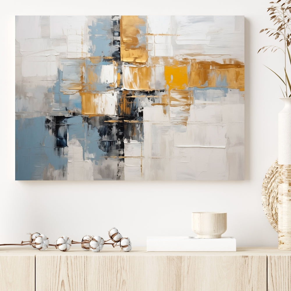 A stunning triptych of the Blue Orange Abstract Wall Art Canvas Print adorns the wall. These gallery-wrapped abstract pieces, showcasing blue, yellow, and white tones, feature a UV-protective coating to maintain their vivid colors.