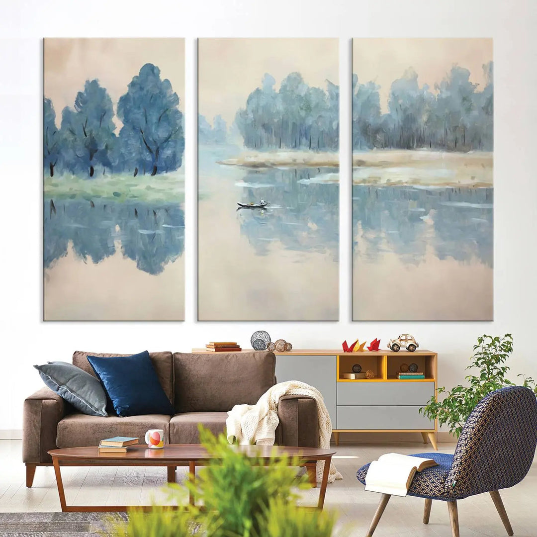 The triptych canvas print, "Blue Trees and Water Reflection Landscape," showcases a serene lake and boat scene through giclee printing. The blue trees reflecting on the water create a calming ambiance, making it an ideal choice for nature lovers.