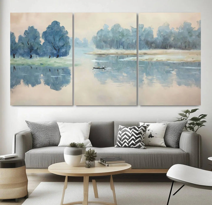 The triptych canvas print, "Blue Trees and Water Reflection Landscape," showcases a serene lake and boat scene through giclee printing. The blue trees reflecting on the water create a calming ambiance, making it an ideal choice for nature lovers.