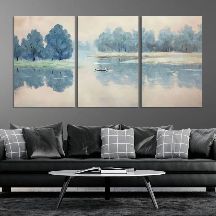 The triptych canvas print, "Blue Trees and Water Reflection Landscape," showcases a serene lake and boat scene through giclee printing. The blue trees reflecting on the water create a calming ambiance, making it an ideal choice for nature lovers.