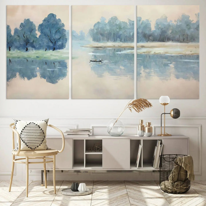 The triptych canvas print, "Blue Trees and Water Reflection Landscape," showcases a serene lake and boat scene through giclee printing. The blue trees reflecting on the water create a calming ambiance, making it an ideal choice for nature lovers.