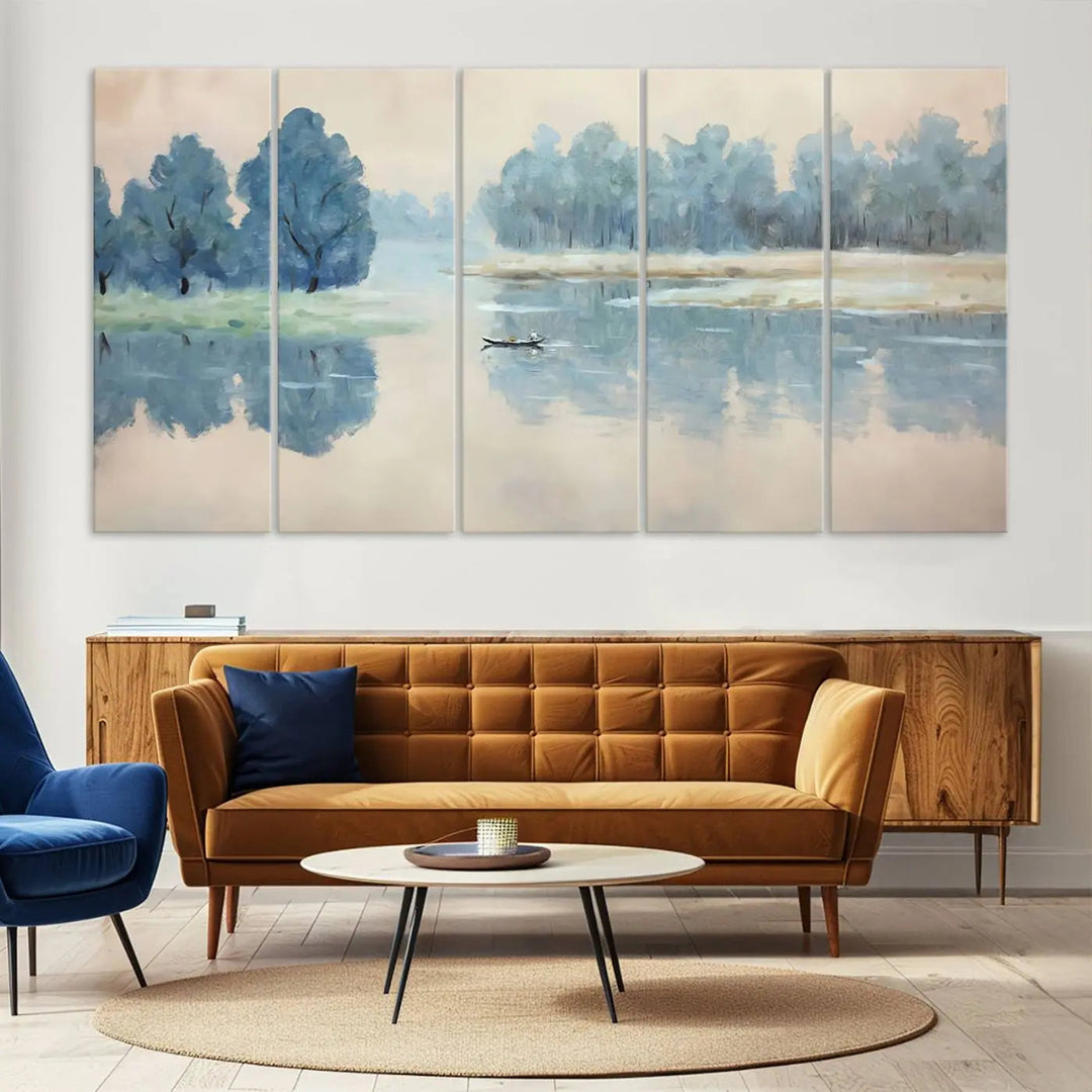 The triptych canvas print, "Blue Trees and Water Reflection Landscape," showcases a serene lake and boat scene through giclee printing. The blue trees reflecting on the water create a calming ambiance, making it an ideal choice for nature lovers.