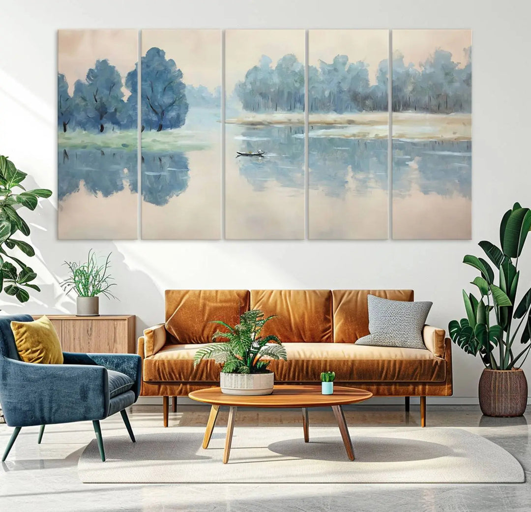 The triptych canvas print, "Blue Trees and Water Reflection Landscape," showcases a serene lake and boat scene through giclee printing. The blue trees reflecting on the water create a calming ambiance, making it an ideal choice for nature lovers.