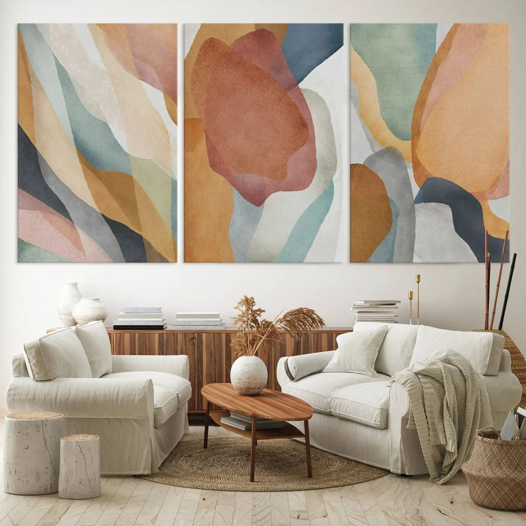 The Boho Wall Art Canvas Print Set, featuring warm hues in an abstract triptych, is presented on museum-quality canvas.