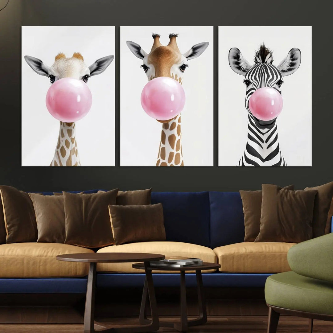 The Bubblegum Animals Canvas Wall Art, featuring a playful trio of giraffe and zebra portraits blowing pink bubblegum, brings charm and whimsy to your space. Ideal for nursery wall art or any fun area, this delightful decor piece is ready to hang and perfect for creating a playful atmosphere.