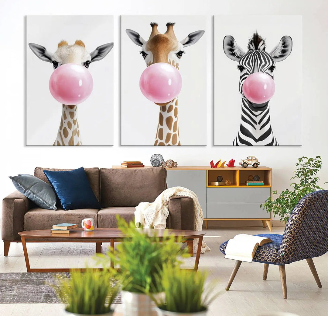 The Bubblegum Animals Canvas Wall Art, featuring a playful trio of giraffe and zebra portraits blowing pink bubblegum, brings charm and whimsy to your space. Ideal for nursery wall art or any fun area, this delightful decor piece is ready to hang and perfect for creating a playful atmosphere.