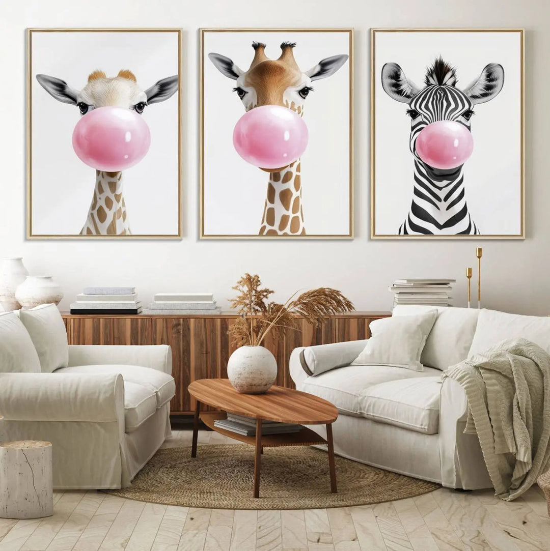 The Bubblegum Animals Canvas Wall Art, featuring a playful trio of giraffe and zebra portraits blowing pink bubblegum, brings charm and whimsy to your space. Ideal for nursery wall art or any fun area, this delightful decor piece is ready to hang and perfect for creating a playful atmosphere.