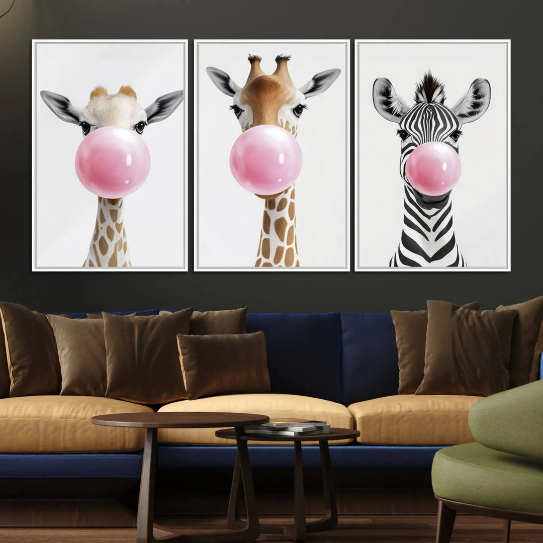 The Bubblegum Animals Canvas Wall Art, featuring a playful trio of giraffe and zebra portraits blowing pink bubblegum, brings charm and whimsy to your space. Ideal for nursery wall art or any fun area, this delightful decor piece is ready to hang and perfect for creating a playful atmosphere.