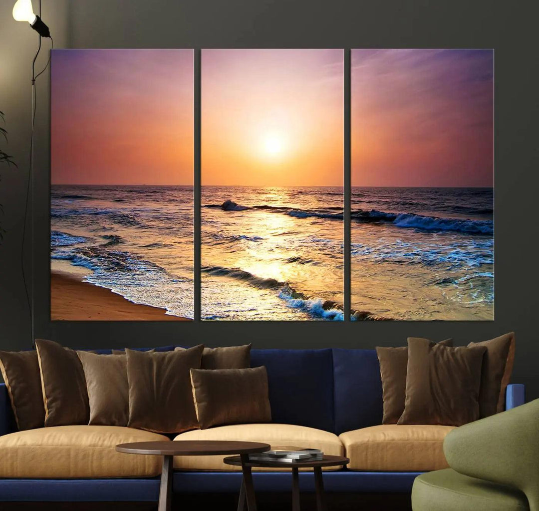 A cozy living room features the breathtaking California Coastline Sunset Canvas Art, capturing ocean waves crashing on cliffs to create the perfect coastal ambiance.