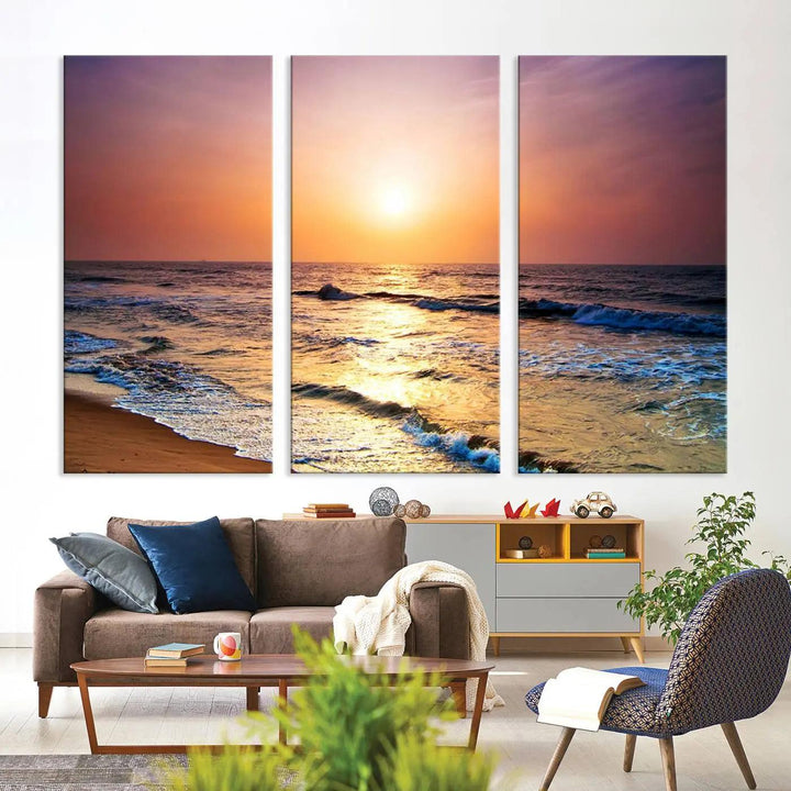 A cozy living room features the breathtaking California Coastline Sunset Canvas Art, capturing ocean waves crashing on cliffs to create the perfect coastal ambiance.