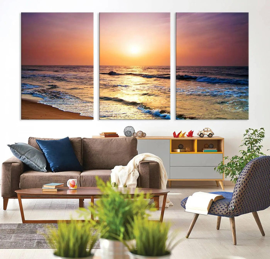 A cozy living room features the breathtaking California Coastline Sunset Canvas Art, capturing ocean waves crashing on cliffs to create the perfect coastal ambiance.