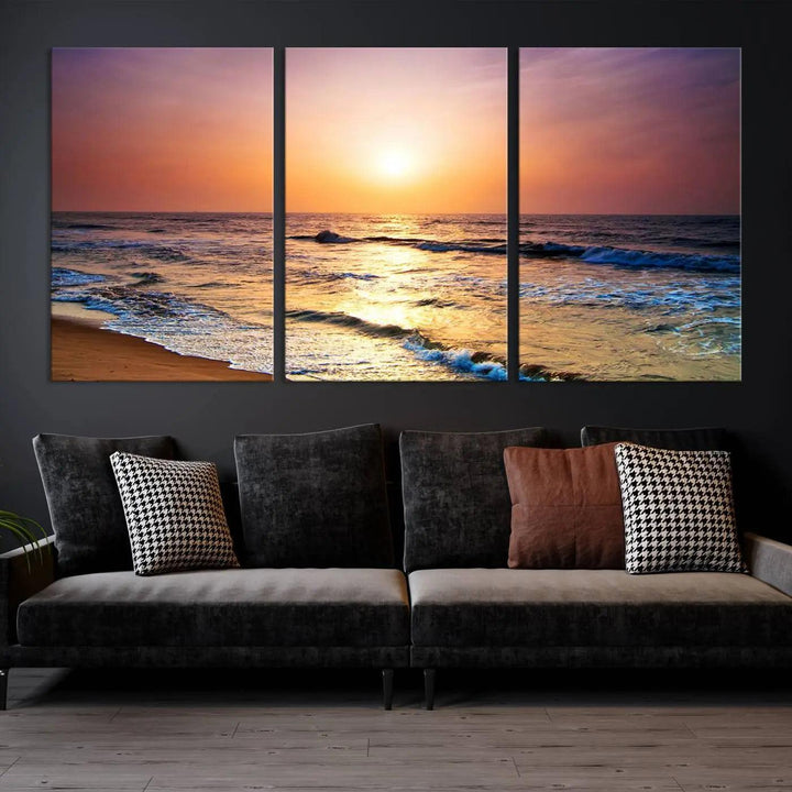 A cozy living room features the breathtaking California Coastline Sunset Canvas Art, capturing ocean waves crashing on cliffs to create the perfect coastal ambiance.