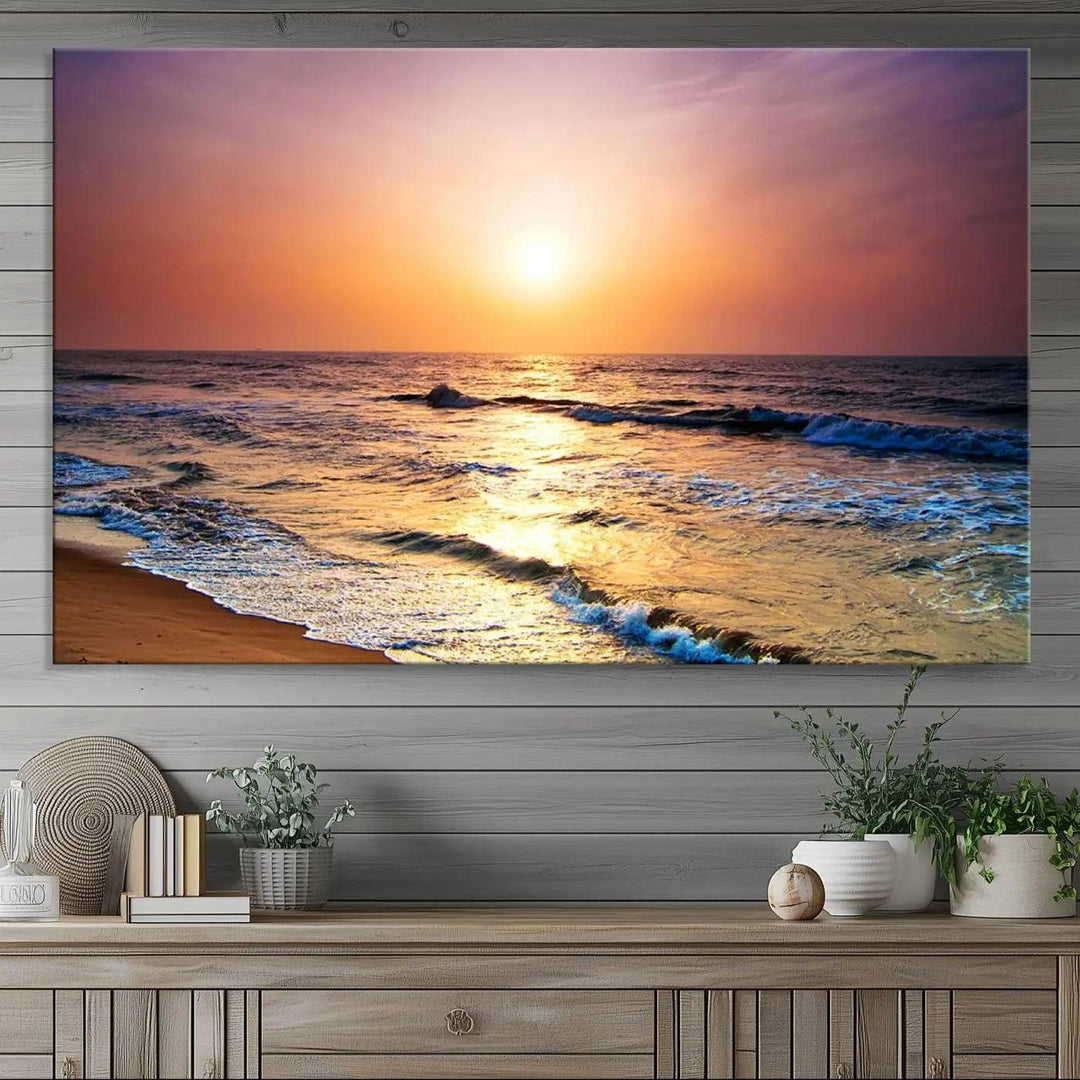 A cozy living room features the breathtaking California Coastline Sunset Canvas Art, capturing ocean waves crashing on cliffs to create the perfect coastal ambiance.