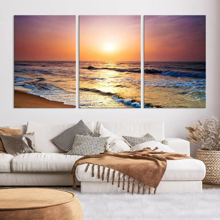 A cozy living room features the breathtaking California Coastline Sunset Canvas Art, capturing ocean waves crashing on cliffs to create the perfect coastal ambiance.