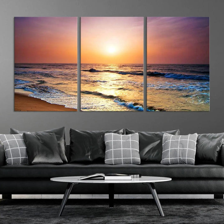 A cozy living room features the breathtaking California Coastline Sunset Canvas Art, capturing ocean waves crashing on cliffs to create the perfect coastal ambiance.