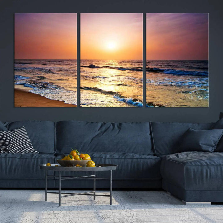 A cozy living room features the breathtaking California Coastline Sunset Canvas Art, capturing ocean waves crashing on cliffs to create the perfect coastal ambiance.