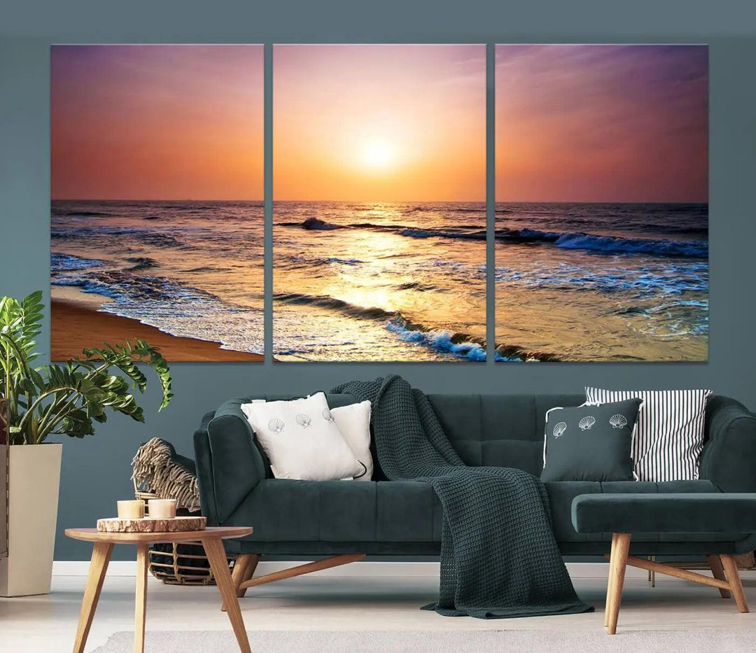 A cozy living room features the breathtaking California Coastline Sunset Canvas Art, capturing ocean waves crashing on cliffs to create the perfect coastal ambiance.